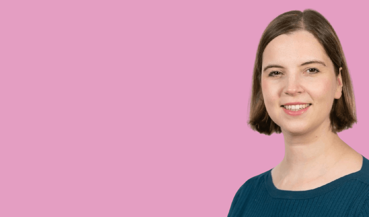 A portrait picture of Veronica Humble, Cushon's Chief Investment Officer, on a pink background